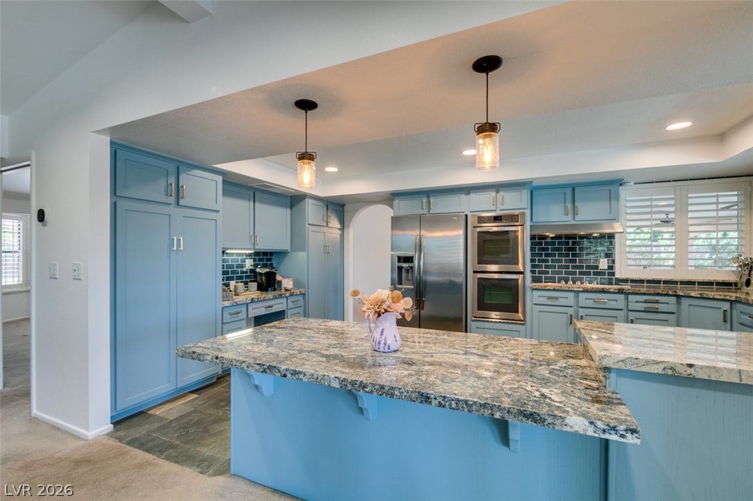 2246 Almart Circle, Henderson, NV 89014 Gleaming granite countertops anchor this beautifully updated kitchen with customized cabinetry.