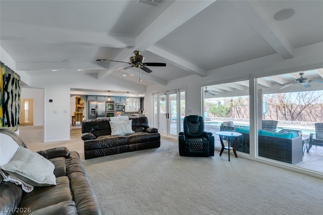 2246 Almart Circle, Henderson, NV 89014 Beamed ceilings and expansive glass walls highlight this airy, open-concept living space.