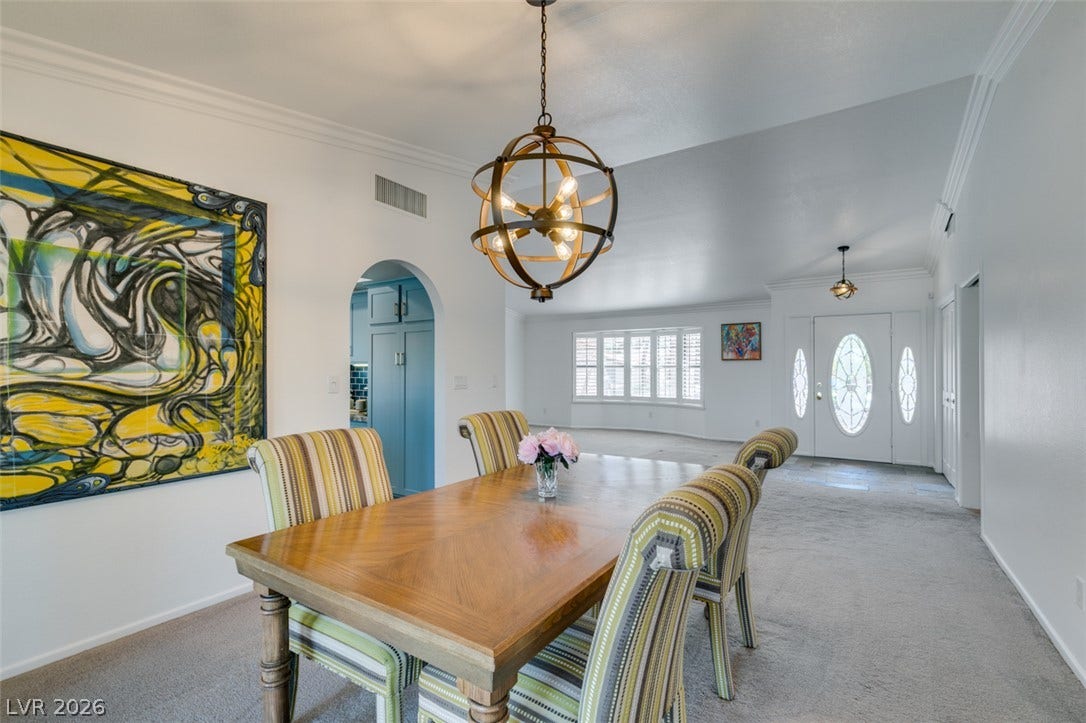 2246 Almart Circle, Henderson, NV 89014 An open floorplan seamlessly connects the dining room to the bright front entryway.