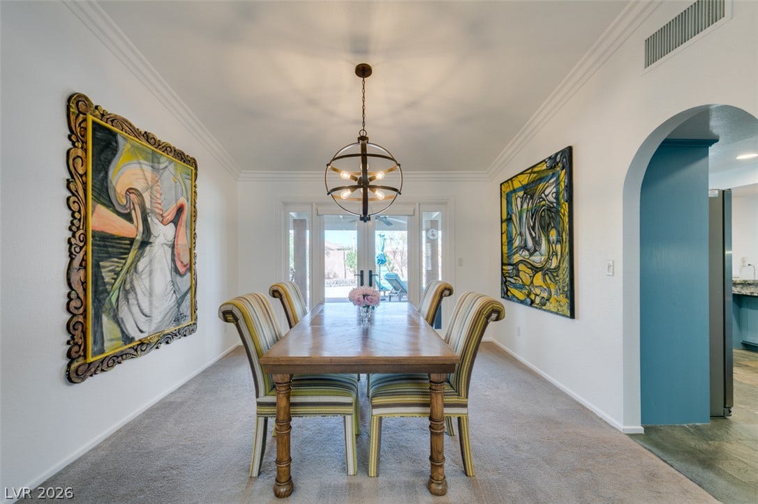 2246 Almart Circle, Henderson, NV 89014 Elegant crown molding and an arched doorway define this inviting formal dining room.