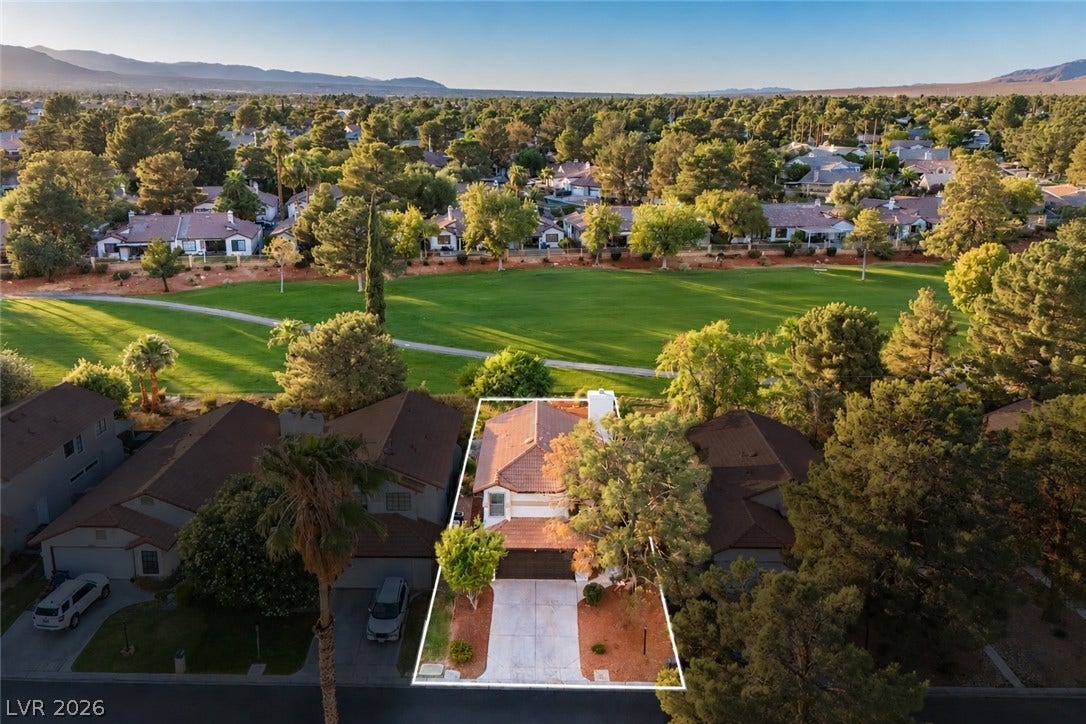 4877 Fiesta Lakes Street, Las Vegas, NV 89130 An aerial perspective showcases this property bordering a golf course green.