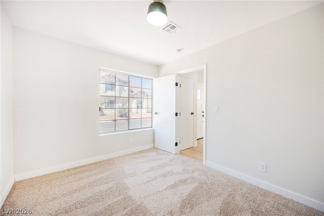2822 Sesame Drive, Las Vegas, NV 89142 Plush carpeting and a multi-paned window define this comfortable secondary bedroom.