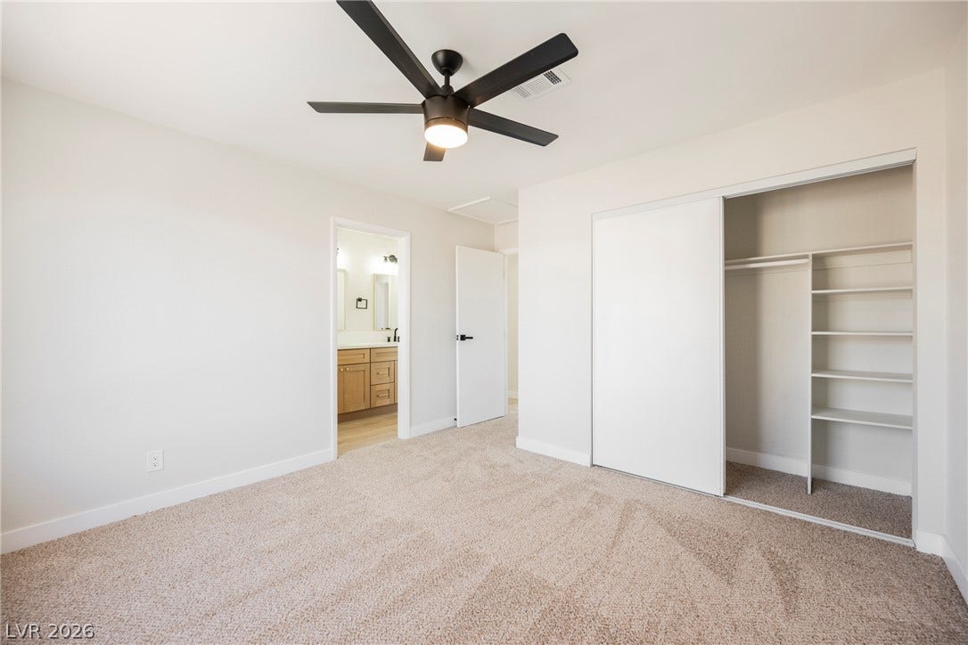 2822 Sesame Drive, Las Vegas, NV 89142 Soft carpeting pairs with neutral walls in this comfortable bedroom featuring an integrated closet system.