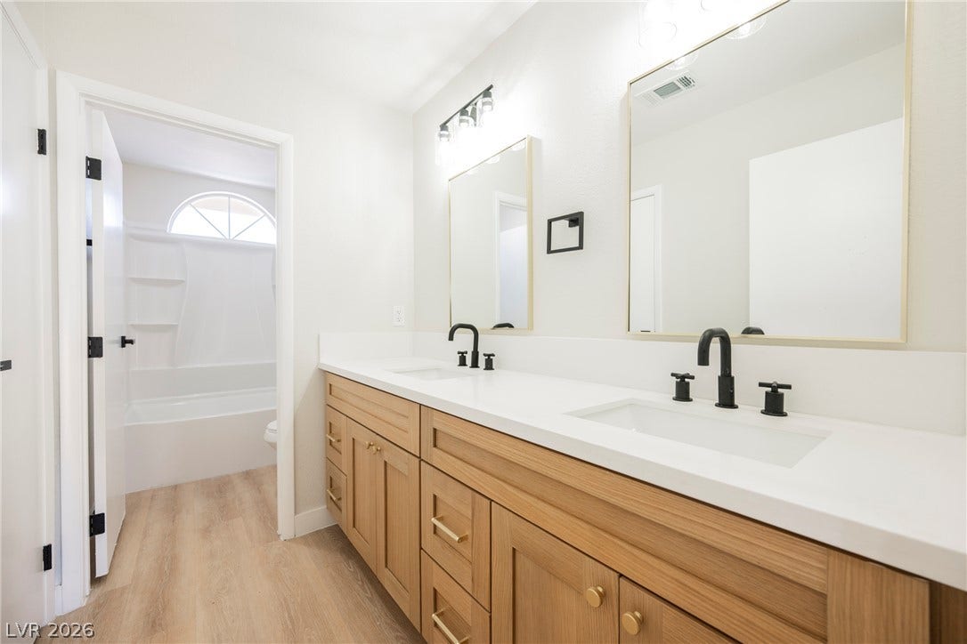 2822 Sesame Drive, Las Vegas, NV 89142 Clean lines and a spacious dual vanity define this updated bathroom space.