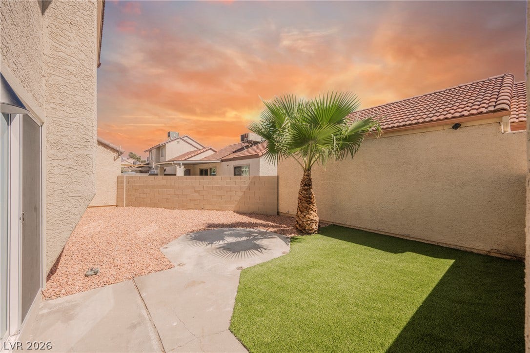 2822 Sesame Drive, Las Vegas, NV 89142 A private concrete patio leads to low-maintenance landscaping and enclosed block wall fencing.