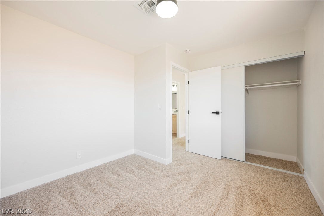 2822 Sesame Drive, Las Vegas, NV 89142 Plush carpeting and an integrated closet define this comfortable secondary bedroom.
