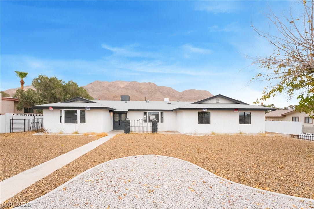 Majestic mountain ridges provide a dramatic backdrop for this classic single-story ranch home.