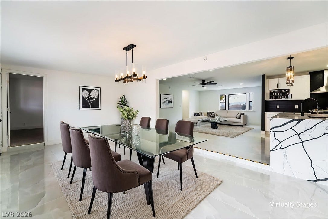 Polished tile flooring flows seamlessly through this open-concept dining area and adjacent living spaces.