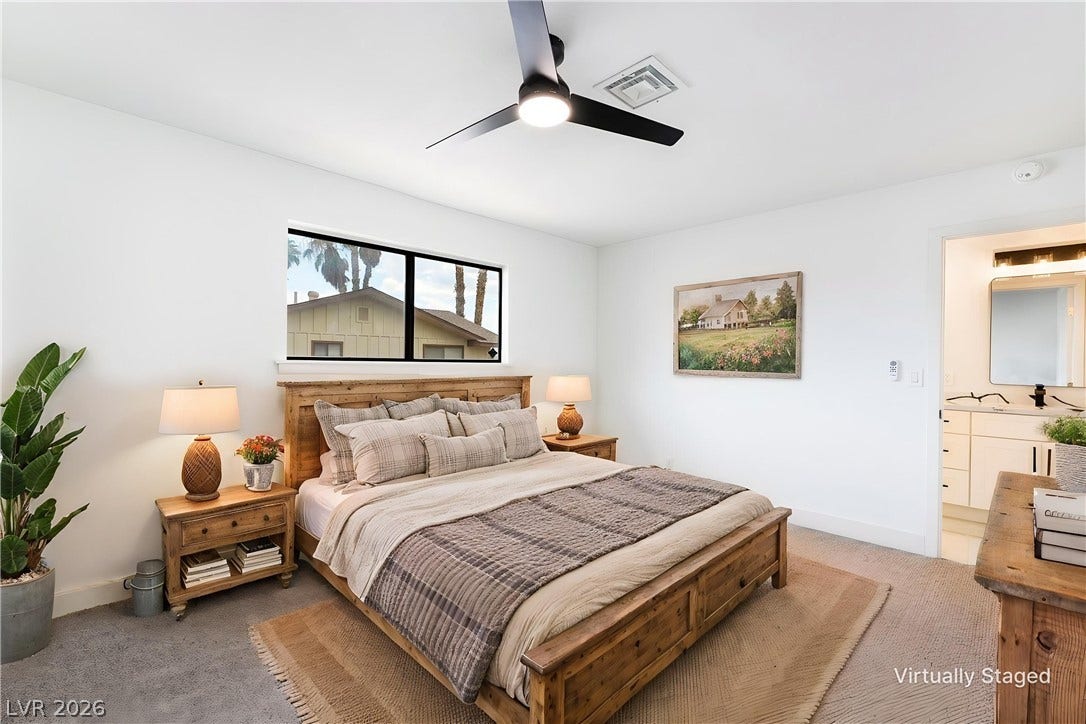 An inviting bedroom layout connects seamlessly to a clean adjoining bathroom.