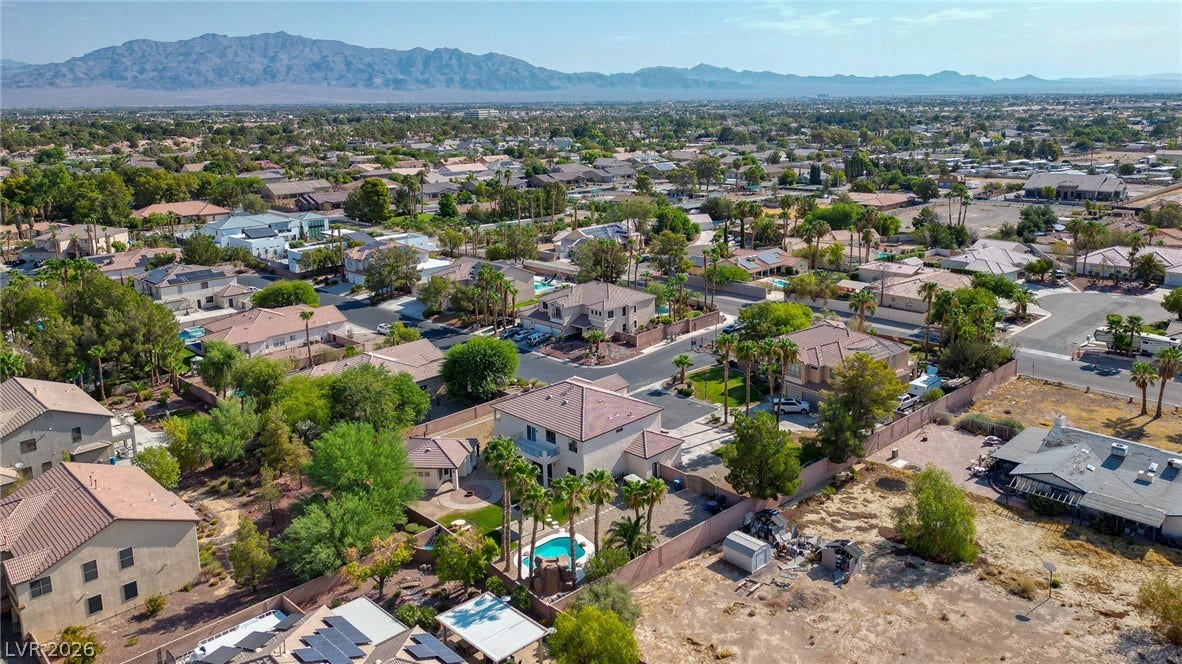 Distant mountains frame a wide perspective of the surrounding residential neighborhood.