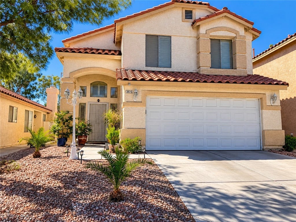 3925 Lilac Haze Street, Las Vegas, NV 89147 Spanish-style roof tiles and a textured stucco exterior create classic curb appeal.