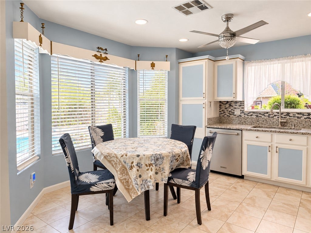 3925 Lilac Haze Street, Las Vegas, NV 89147 Sunlight streams through bay windows in this casual dining area adjoining the kitchen.