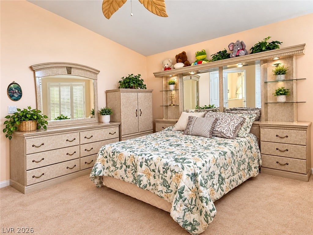 3925 Lilac Haze Street, Las Vegas, NV 89147 Plush carpeting and warm wall tones create a cozy atmosphere in this bedroom.
