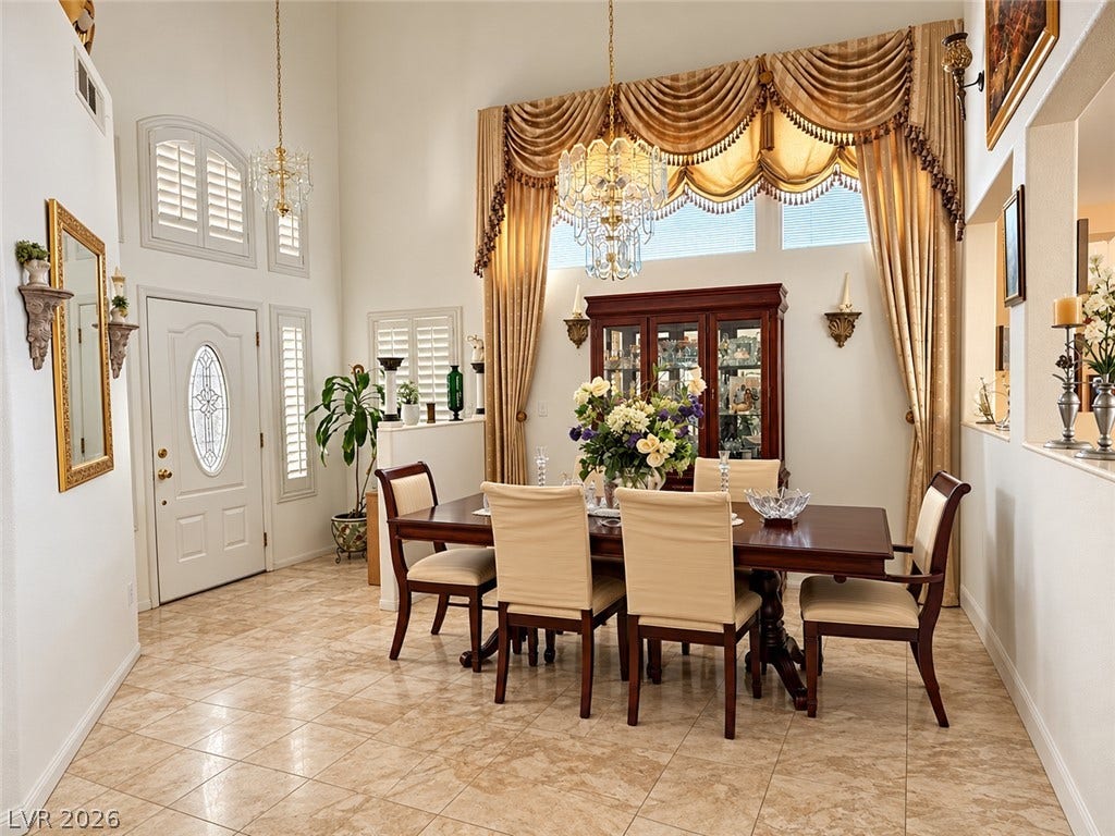 3925 Lilac Haze Street, Las Vegas, NV 89147 High ceilings and polished tile flooring elevate this elegant formal dining area.
