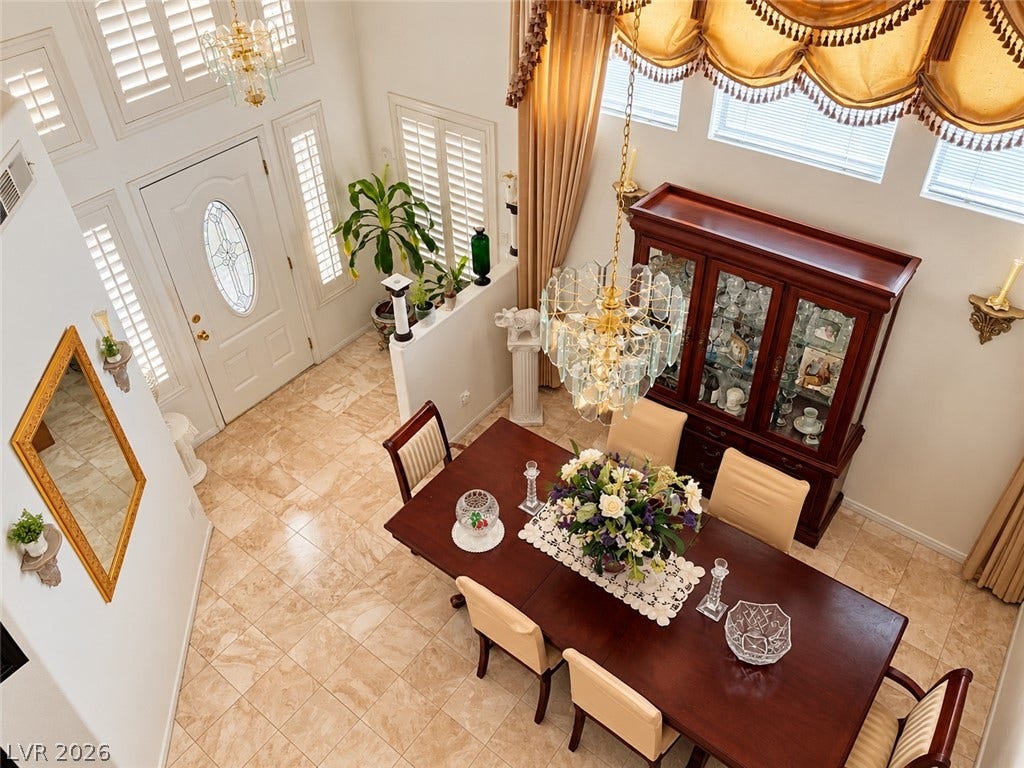 3925 Lilac Haze Street, Las Vegas, NV 89147 Gleaming tile floors and soaring ceilings create an elegant dining space adjacent to the foyer.