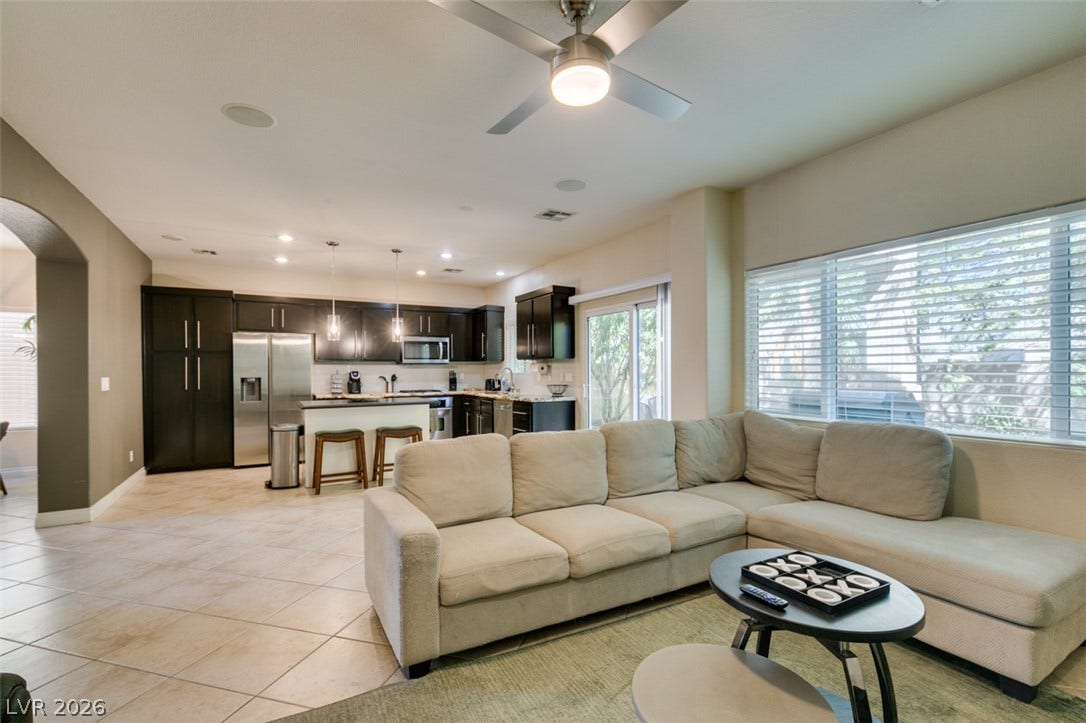 3166 E Eldorado Lane, Las Vegas, NV 89120 An open floorplan seamlessly connects the comfortable living area directly into the modern kitchen.