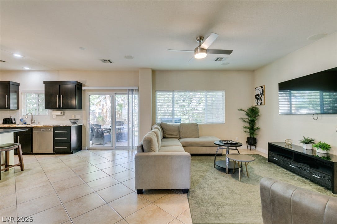3166 E Eldorado Lane, Las Vegas, NV 89120 An open-concept living area flows into the kitchen over diagonal tile flooring.