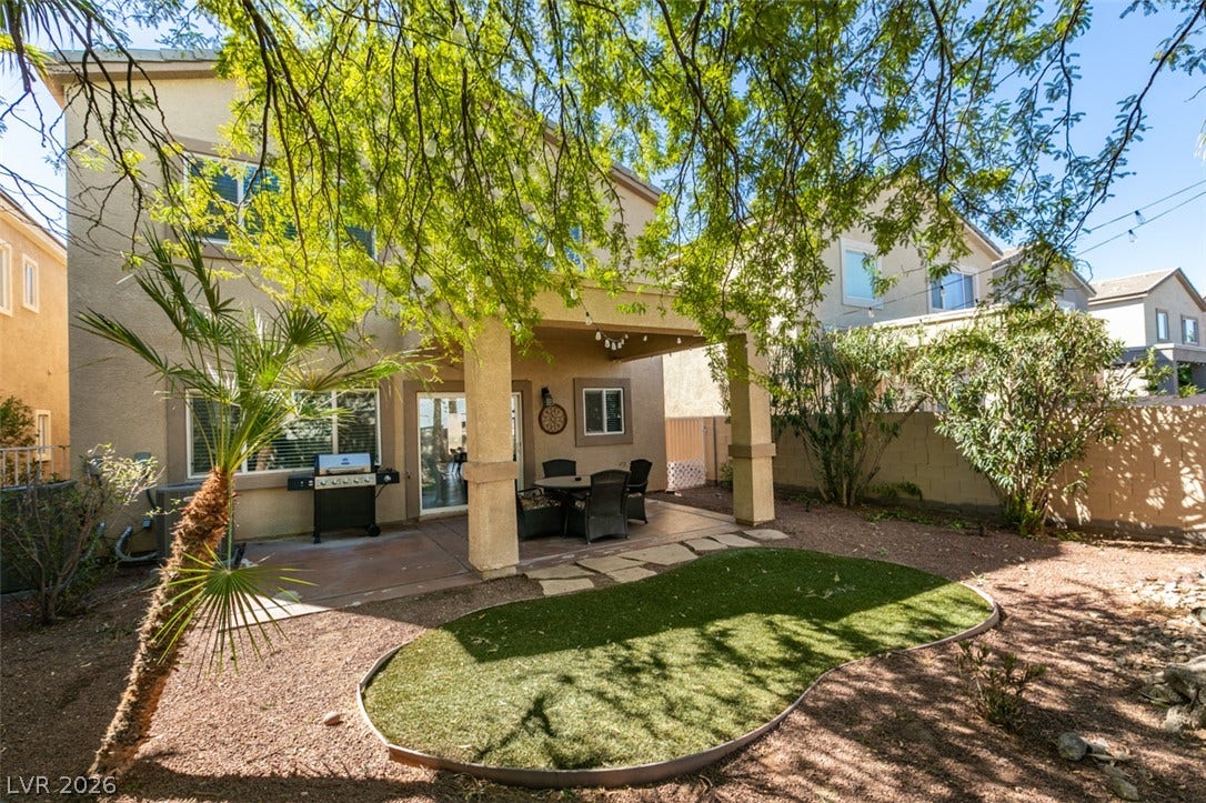 3166 E Eldorado Lane, Las Vegas, NV 89120 A covered concrete patio leads to a low-maintenance backyard enclosed by block fencing.
