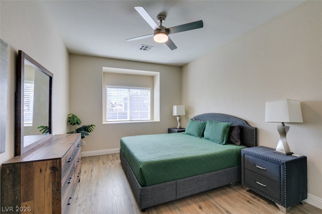 3166 E Eldorado Lane, Las Vegas, NV 89120 Smooth wood floors and a recessed window niche define this inviting space.