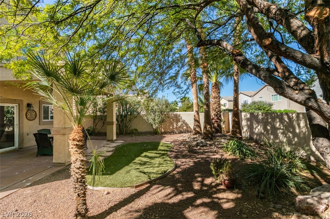 3166 E Eldorado Lane, Las Vegas, NV 89120 Mature trees shade a private outdoor space bordered by durable perimeter walls.