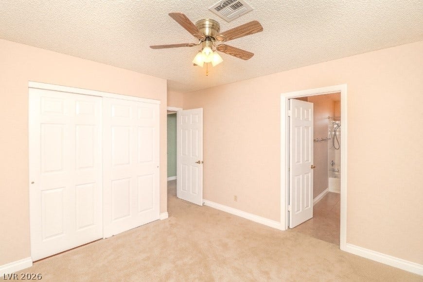1429 Hawkwood Road, Henderson, NV 89014 Plush carpeting and crisp white trim enhance this comfortable bedroom layout.