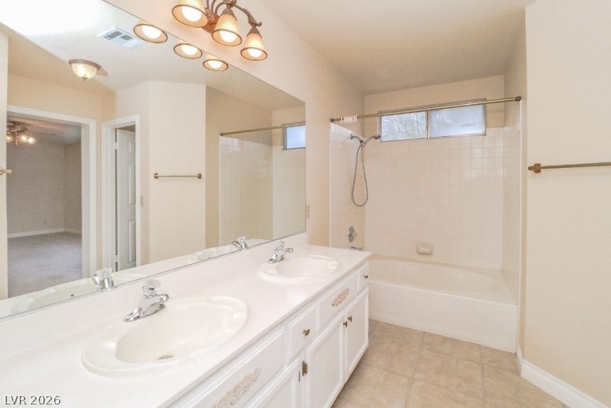 1429 Hawkwood Road, Henderson, NV 89014 A spacious double vanity and a built-in soaking tub define this bathroom.