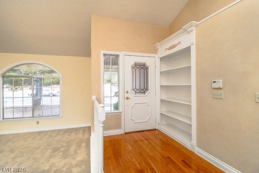 1429 Hawkwood Road, Henderson, NV 89014 An inviting entryway welcomes guests with warm hardwood flooring and built-in shelving.