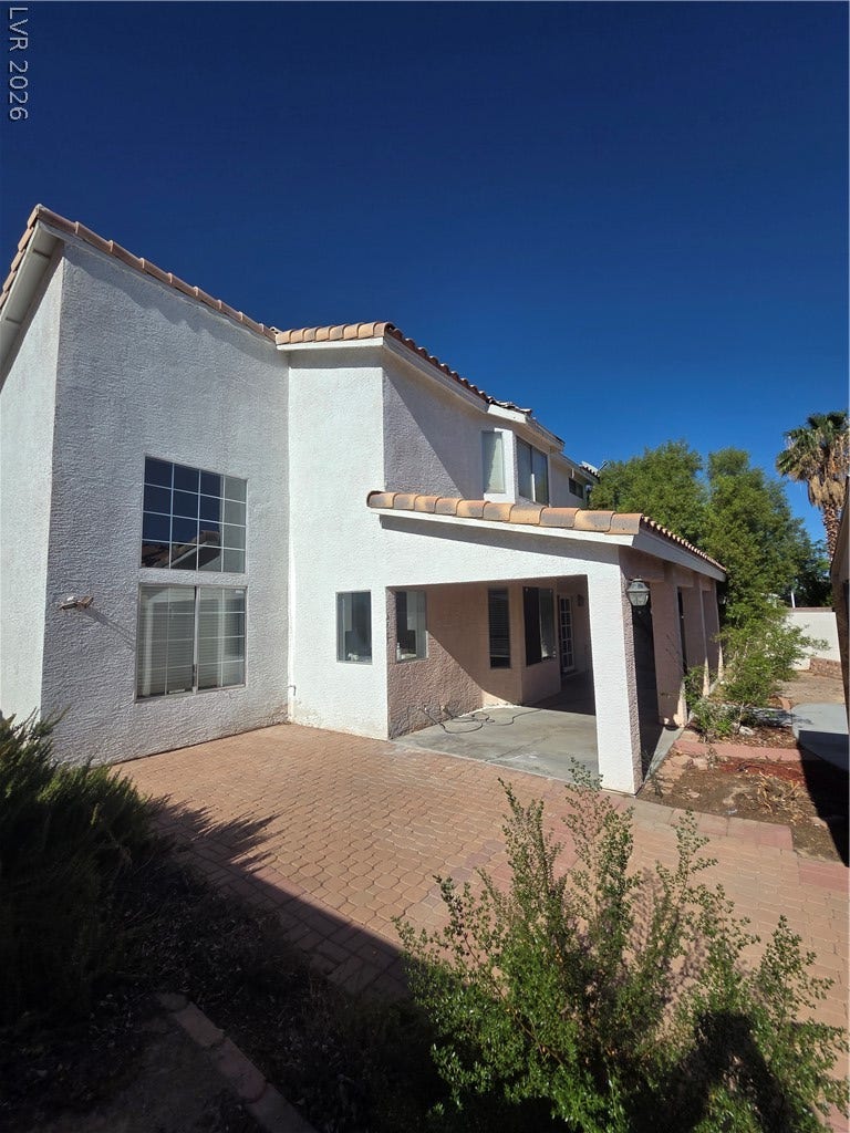 1429 Hawkwood Road, Henderson, NV 89014 Stucco exterior finishes and tiled rooflines frame the side profile of this multi-level home.