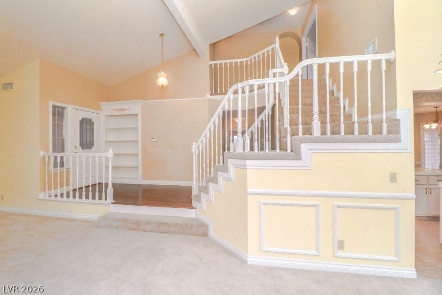 1429 Hawkwood Road, Henderson, NV 89014 Vaulted ceilings and a sweeping staircase welcome guests into this multi-level entry foyer.