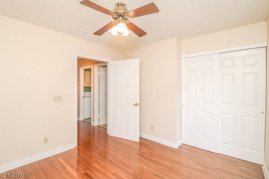1429 Hawkwood Road, Henderson, NV 89014 Rich wood flooring runs throughout this versatile space with ample closet storage.