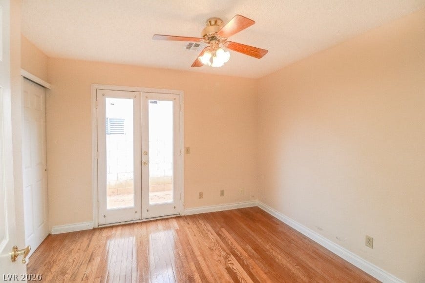 1429 Hawkwood Road, Henderson, NV 89014 Gleaming hardwood floors and classic french doors define this inviting space.