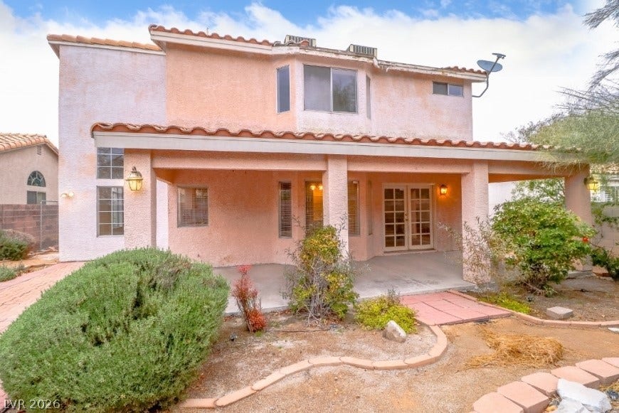 1429 Hawkwood Road, Henderson, NV 89014 A spacious covered patio anchors the backyard of this Spanish-style residence.