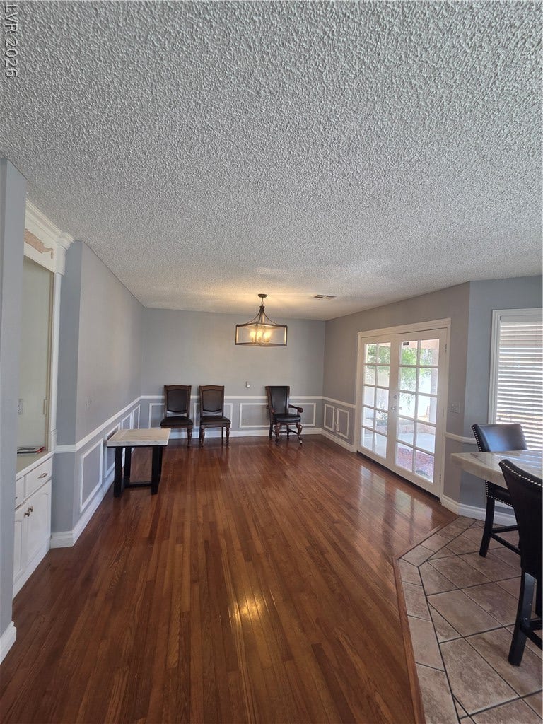 1429 Hawkwood Road, Henderson, NV 89014 Gleaming hardwood floors and classic wainscoting highlight this versatile dining area.
