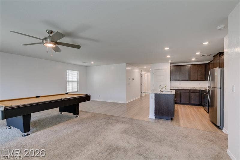 Gleaming wood-look floors complement an airy open layout seamlessly connecting the living and dining areas.
