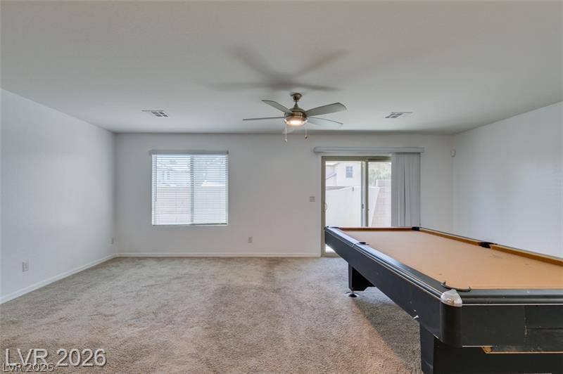 Neutral walls and plush carpeting provide a clean canvas for this versatile bonus space.