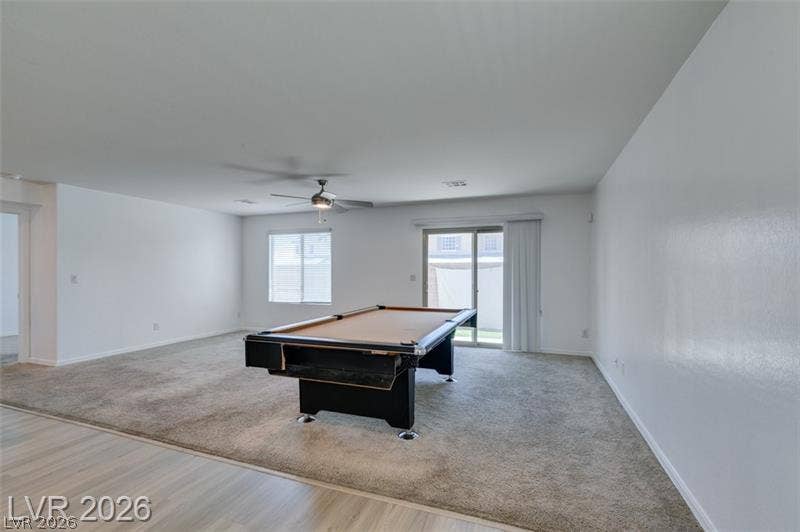Sliding glass doors open to the yard from this versatile carpeted recreation room.
