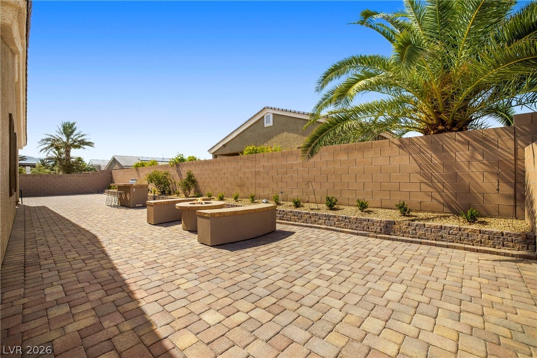 7230 Fresh Harvest Avenue, Las Vegas, NV 89131 A spacious, paver-lined courtyard awaits, perfect for outdoor entertaining.