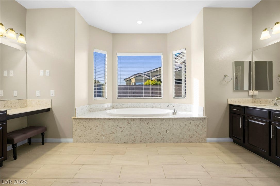 7230 Fresh Harvest Avenue, Las Vegas, NV 89131 Indulge in a tranquil bathing experience with this bathroom's generously sized soaking tub.