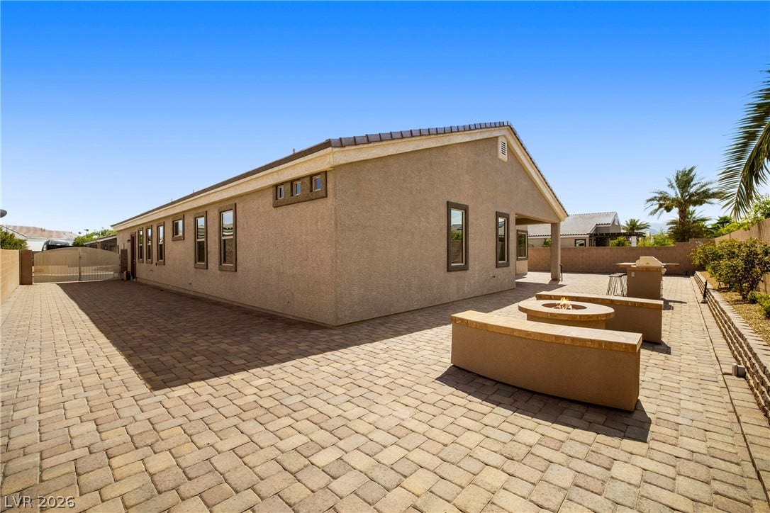 7230 Fresh Harvest Avenue, Las Vegas, NV 89131 12' RV Gate and 74' RV driveway to the backyard. Includes 50AMP power outlet, hose bib and sewer clean out.