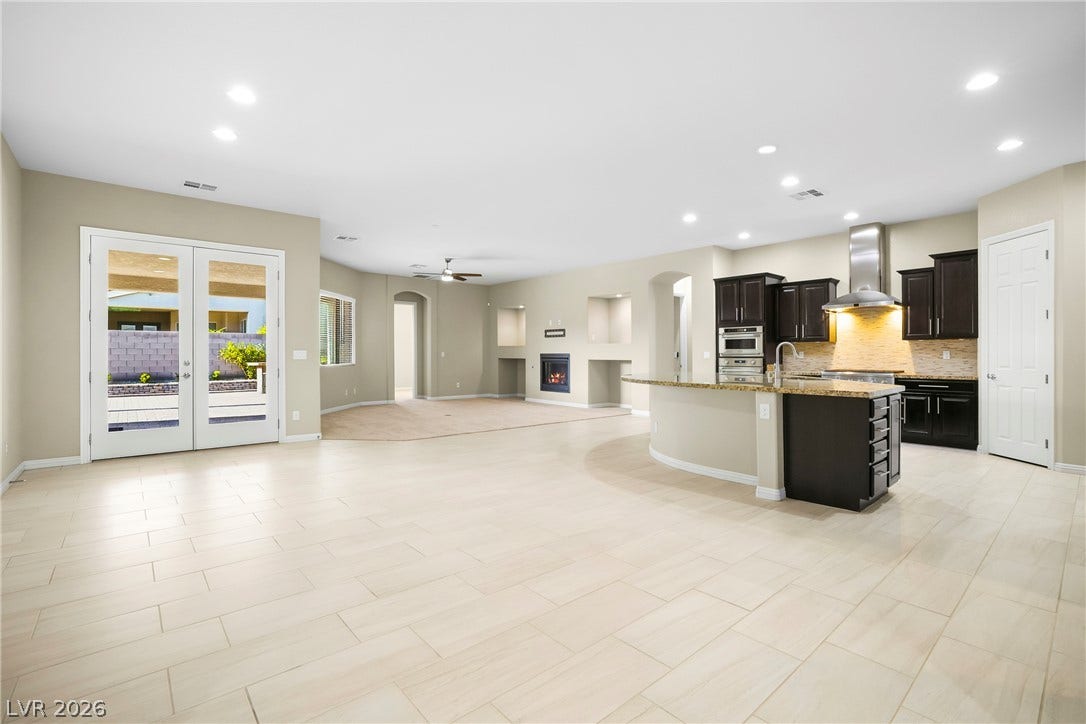 7230 Fresh Harvest Avenue, Las Vegas, NV 89131 10' ceilings welcome you to this modern kitchen, looking toward the amazing backyard.
