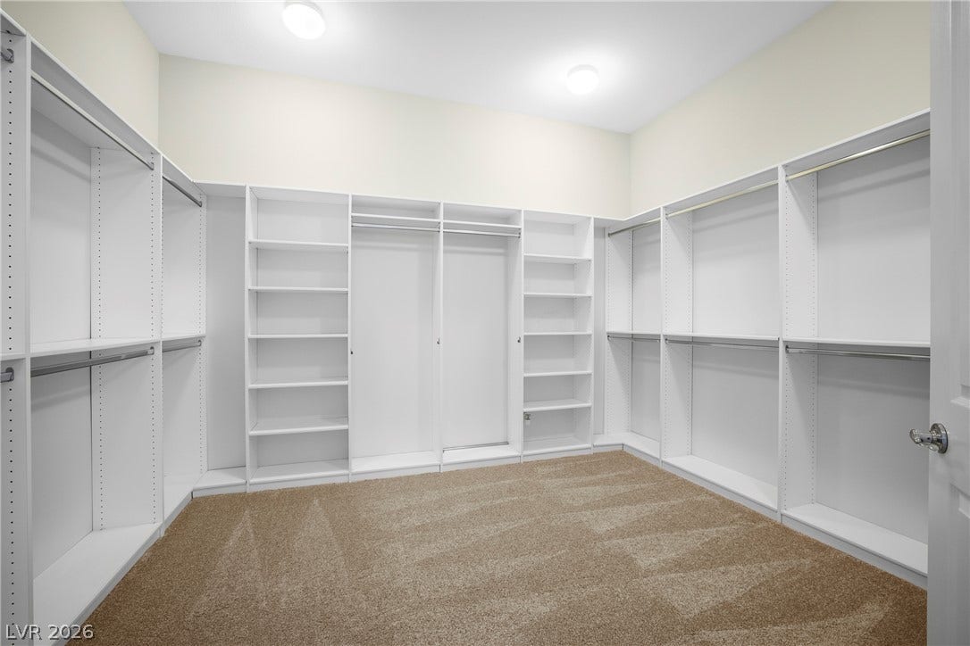 7230 Fresh Harvest Avenue, Las Vegas, NV 89131 Primary Bedroom Walk-in Closet is 12'X11' with built-in organizers for your convenience.