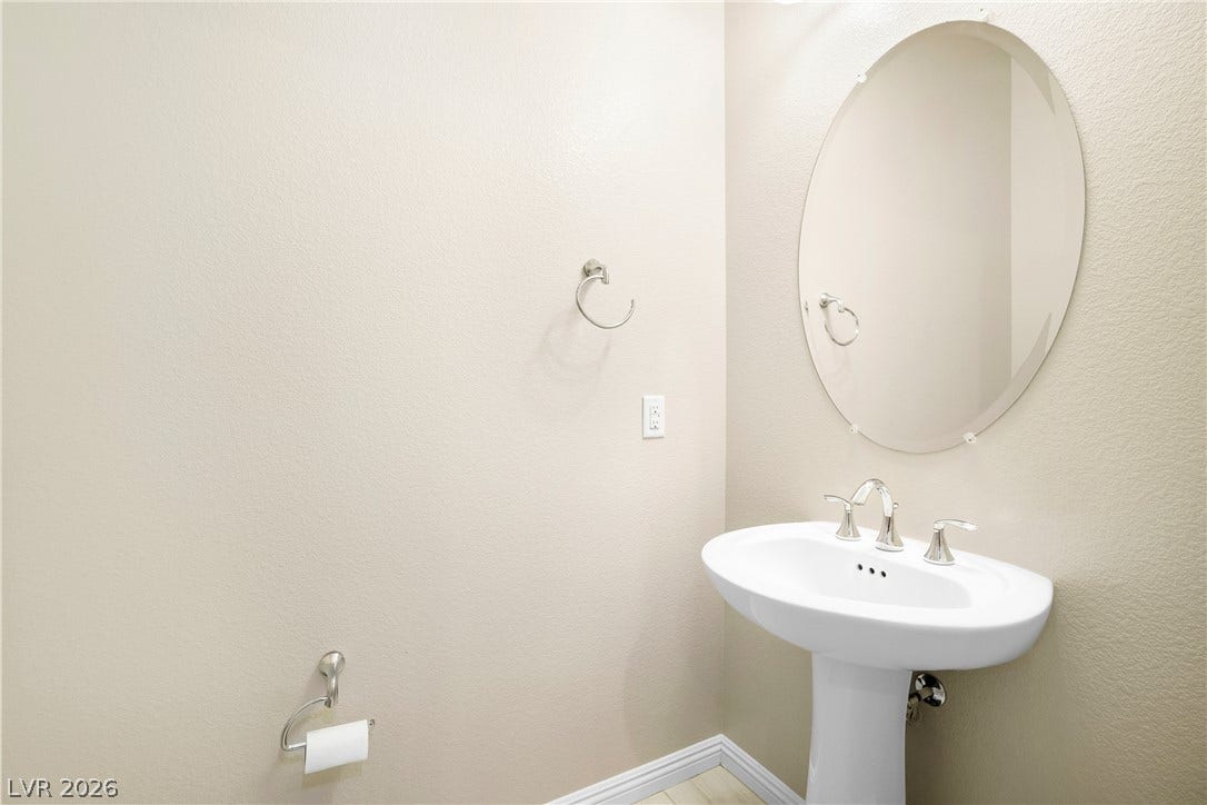 7230 Fresh Harvest Avenue, Las Vegas, NV 89131 This added upgraded guest 1/2 bath is conveniently located between the dining/kitchen/living room.