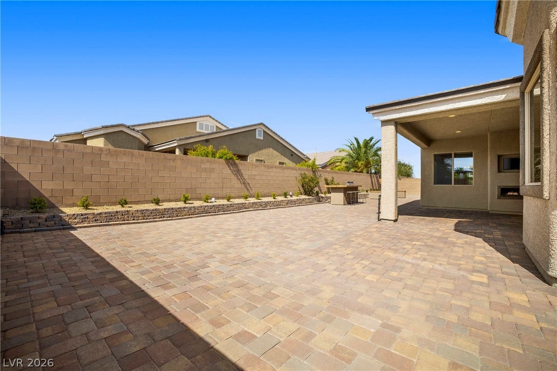 7230 Fresh Harvest Avenue, Las Vegas, NV 89131 An expansive paver patio offers abundant space for outdoor enjoyment.