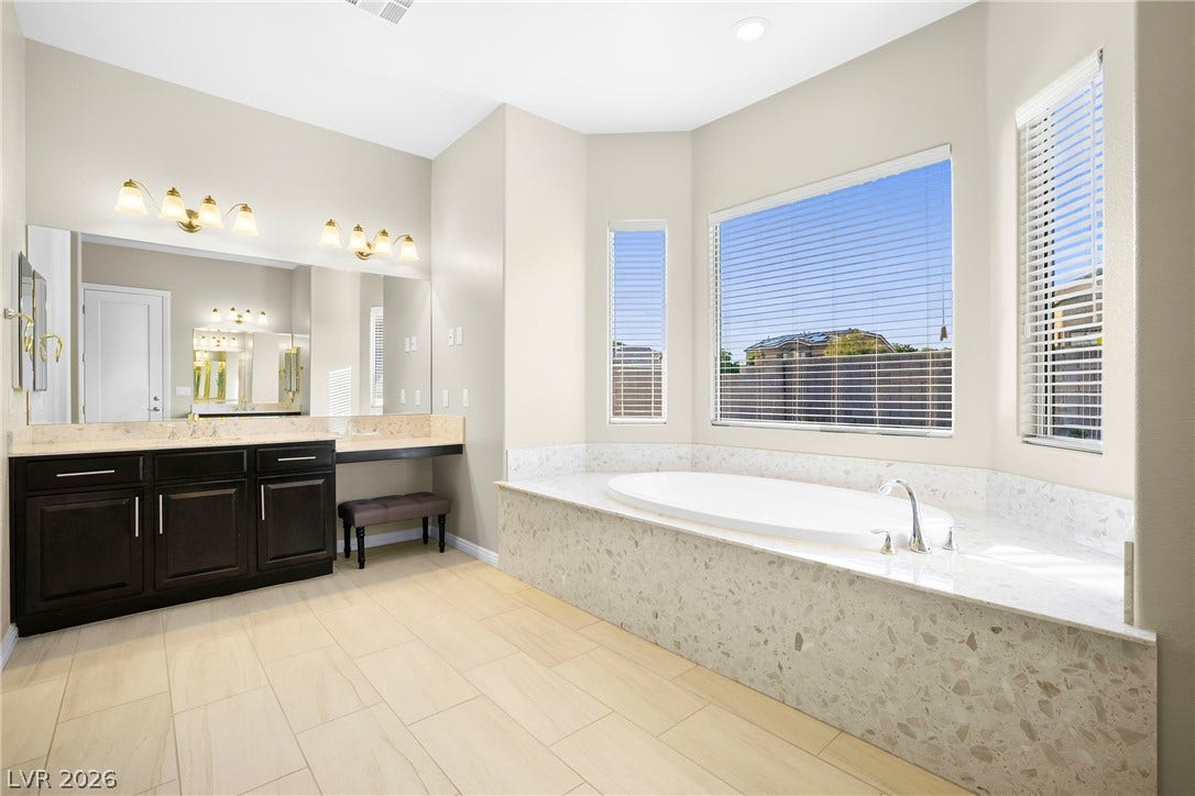 7230 Fresh Harvest Avenue, Las Vegas, NV 89131 Relax in this tranquil primary bathroom with separate sinks and double vanity.