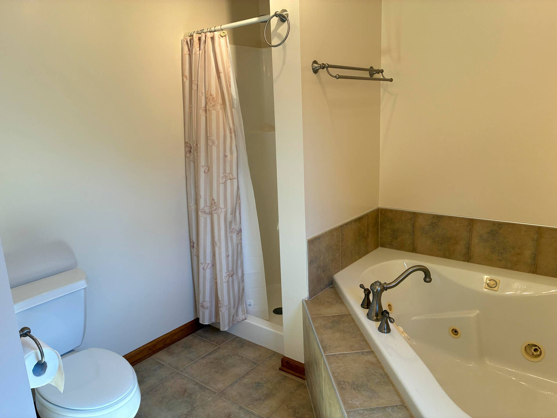 Primary bath with Jacuzzi tub and separa