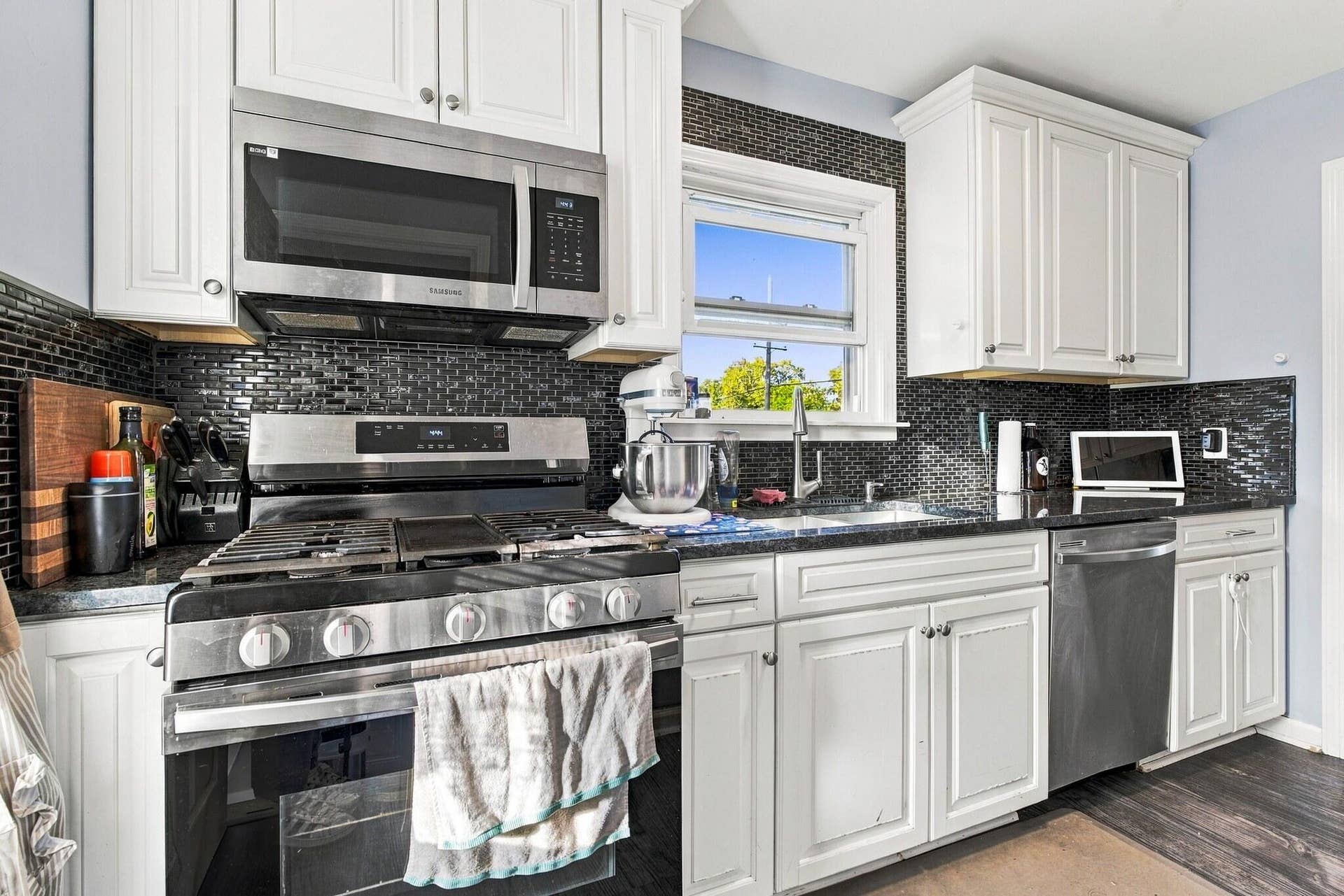 Updated kitchen, white cabinets, granite