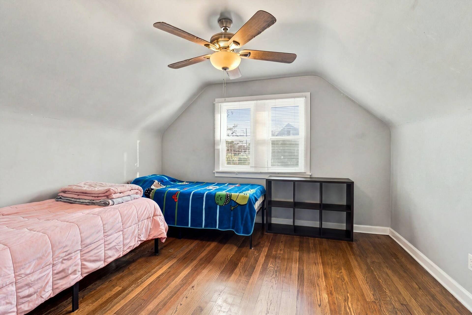 Upstairs bedroom with ceiling fan