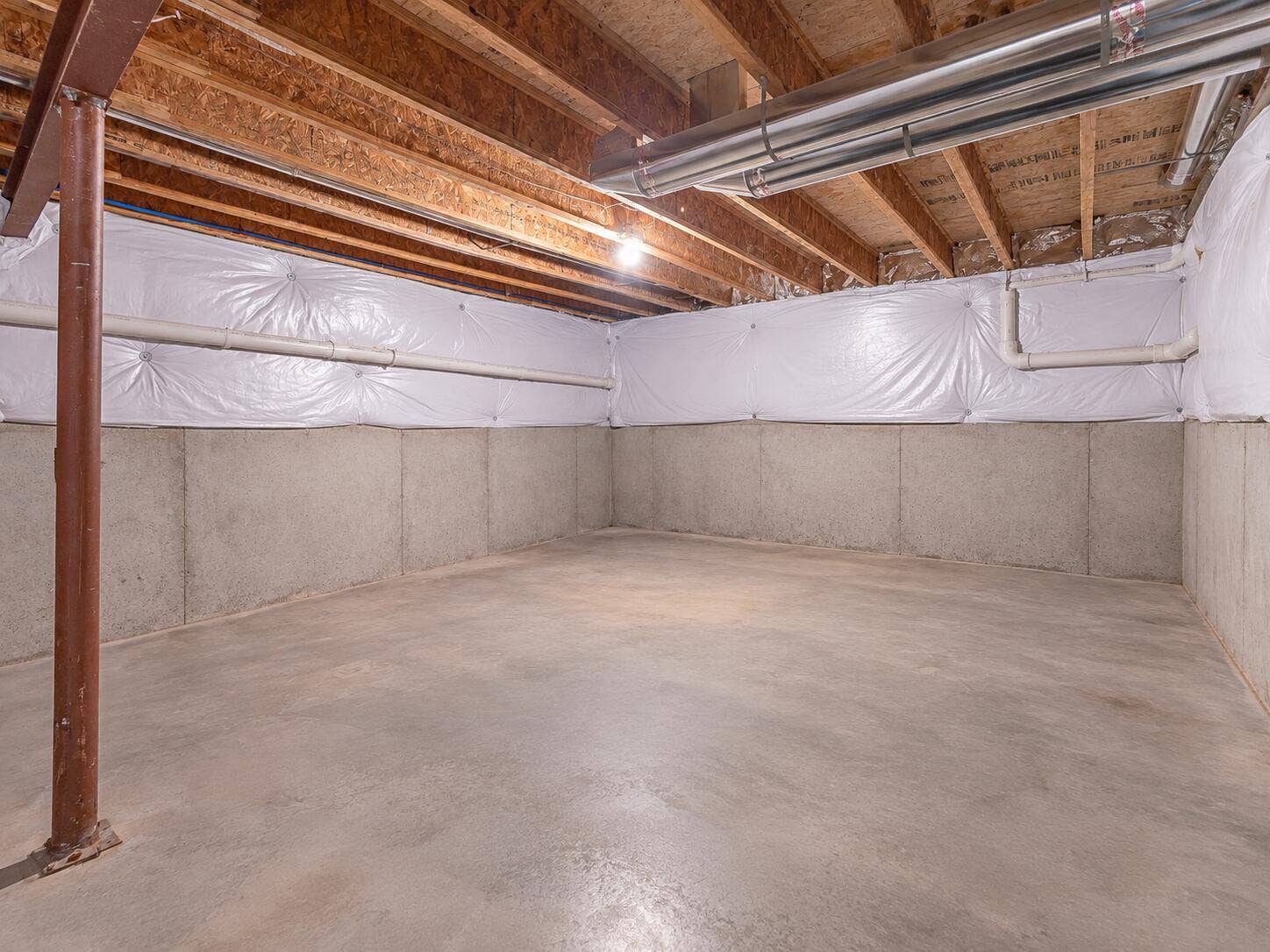 Bright Empty Unfinished Basement with Ex