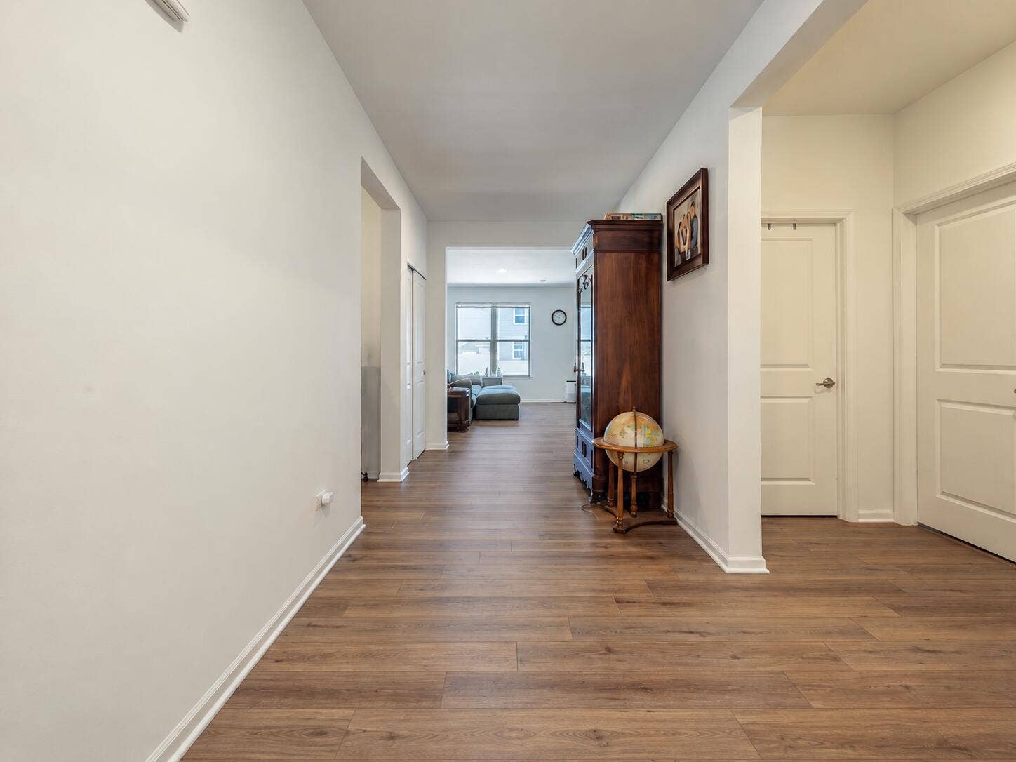 Bright Symmetrical Hallway with Globe an