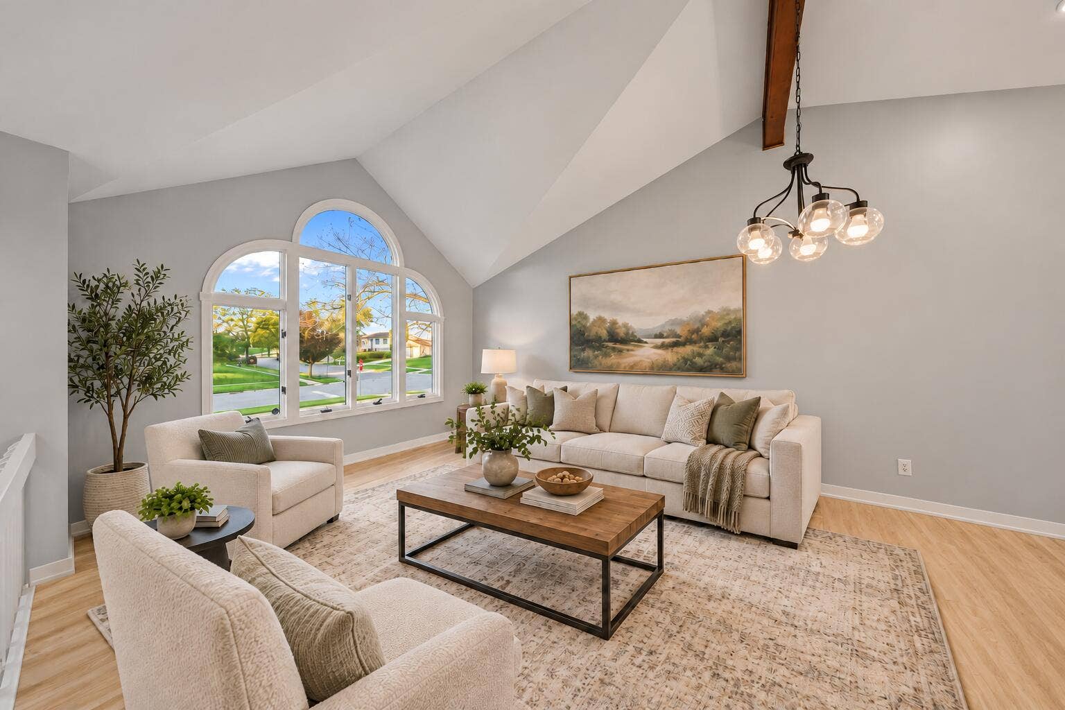 Bright Vaulted Living Room with Arched W